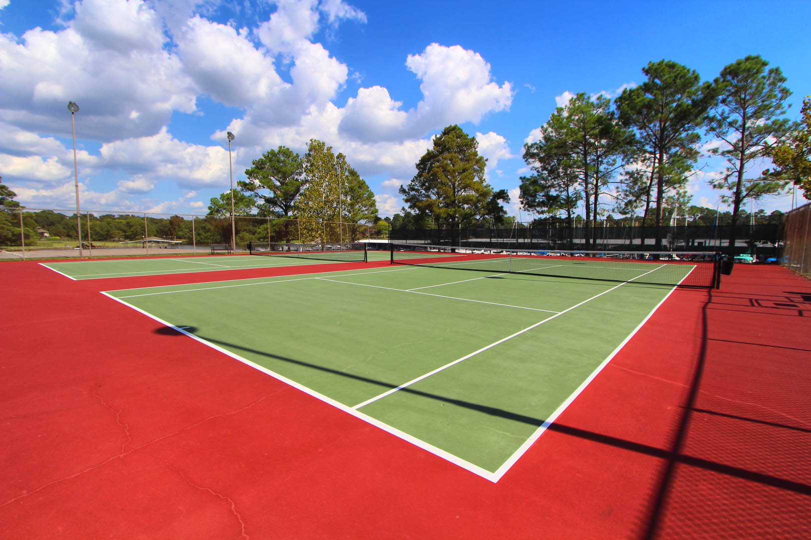 A colorful outdoor tennis court at VRI's The Landing at Seven Coves in Willis, Texas.